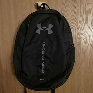 Black and gray Under Armour backpack